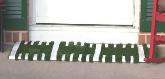 white door mat with green astro turf