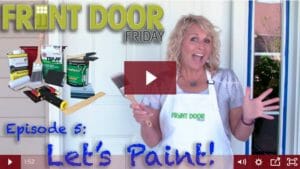 women holding paint brush ready to paint