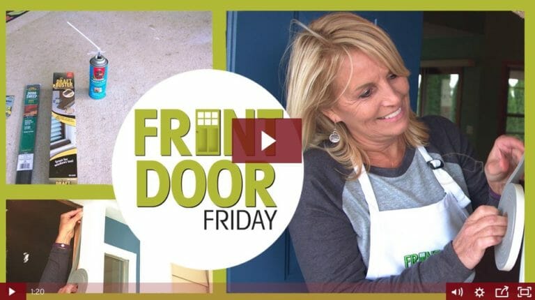 woman applying weather stripping to door jam