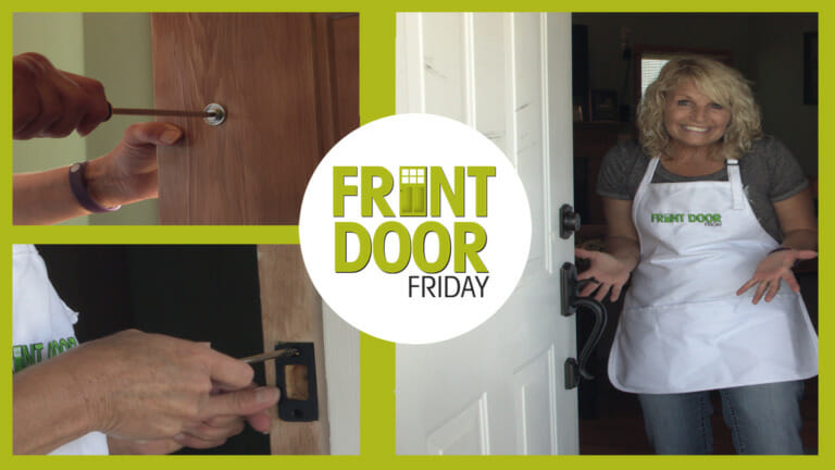 woman showing how to fix a door lock with a screwdriver