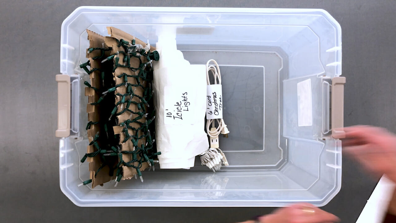 plastic tote used to store extension cords Christmas lights etc.