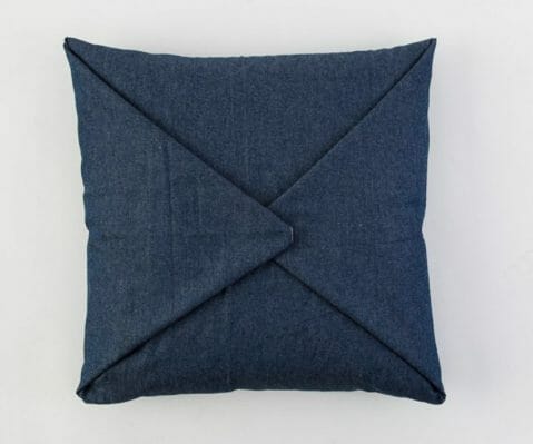 wrapped and pinned denim fabric pillow