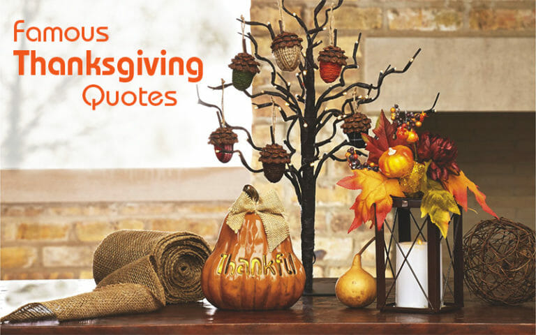 Famous Thanksgiving Quotes – A tree with acorns, a ceramic pumpkin, a burlap roll, a lantern and fall leaves on a wood table.