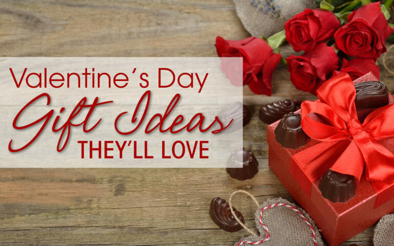 Valentine's Day Gift Ideas They’ll Love – Red roses and a red box with chocolate candies.