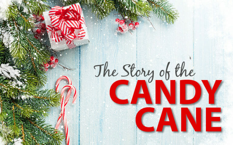 The Story of the Candy Cane – Snowy pine boughs with red berries, two candy canes, and a red stripe bow on a present.