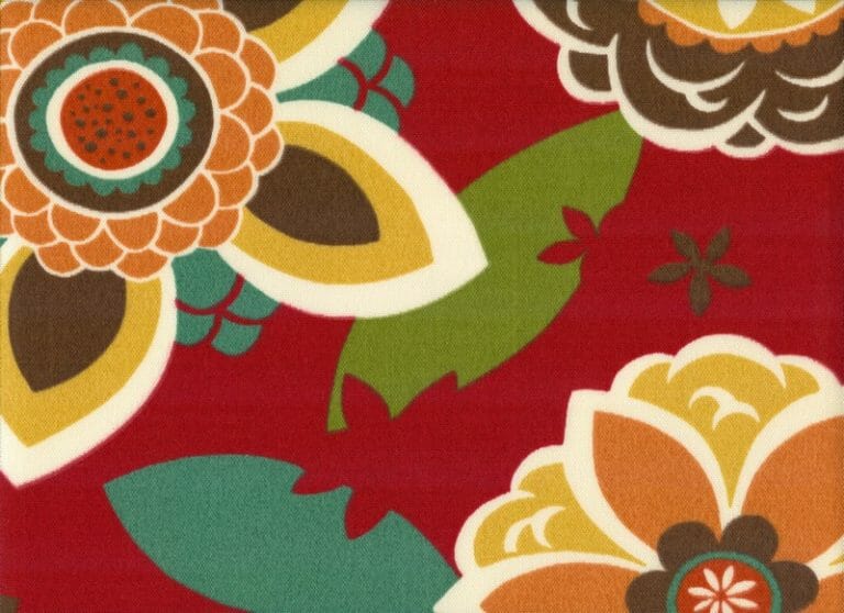 Annie Cherry – A fabric swatch in a multicolor retro floral, in orange, yellow, green, and red.