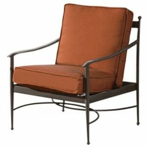 A brown square seat cushion with a brown square back cushion on a black metal patio chair.