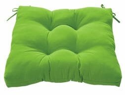 A green square tufted chair seat cushion with ties.