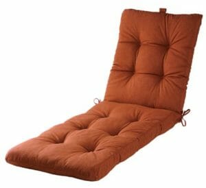 A brown tufted seat and back lounge chair cushion with ties.