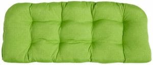 A green tufted bench seat cushion.