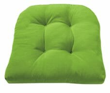 A green tufted chair seat cushion with rounded back.