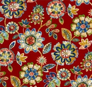 Cherry – A fabric swatch in a multicolor boho floral pattern on a cherry red background.