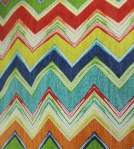 Fiesta – A fabric swatch in a festive multicolor zigzag pattern.