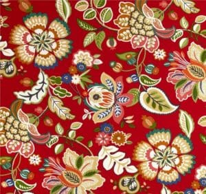 Telfair Cherry – A fabric swatch in a baroque floral pattern in red, tan, blue, and green.