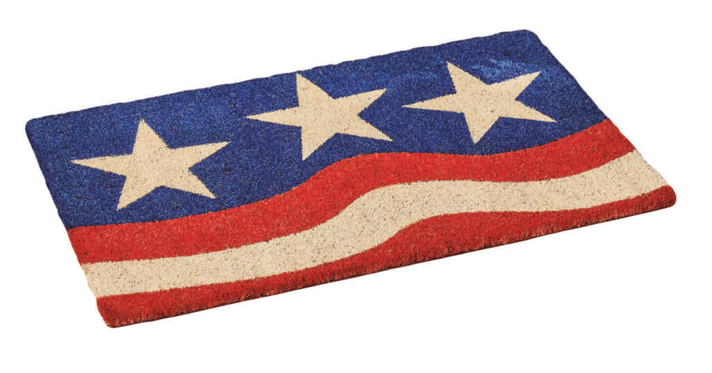 A Patriotic doormat with 3 white stars on blue and red and white stripes.