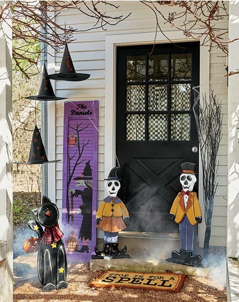 Halloween front door with skull and black cat wood cutouts