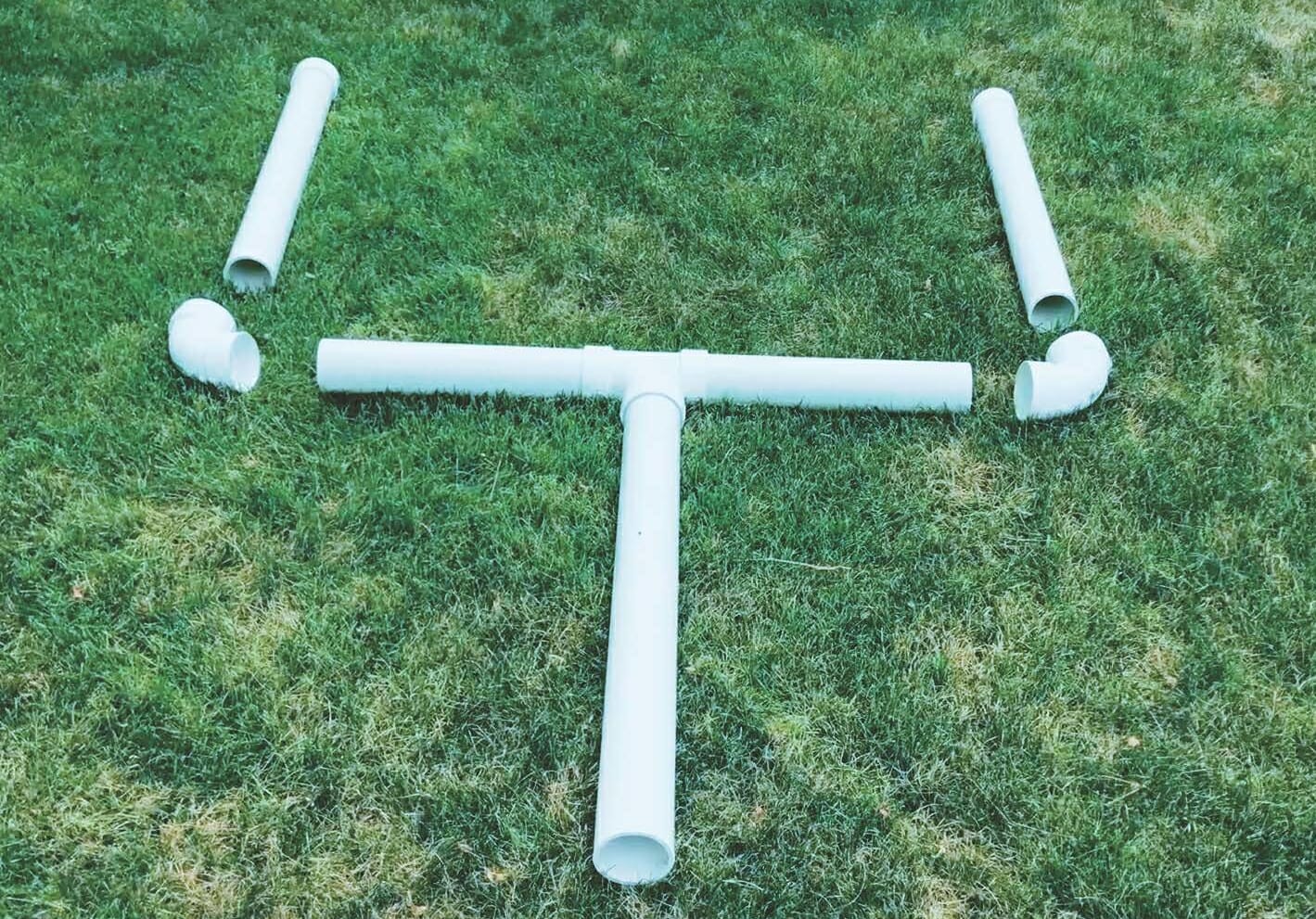 pieces of pvc laid out to create field goal posts