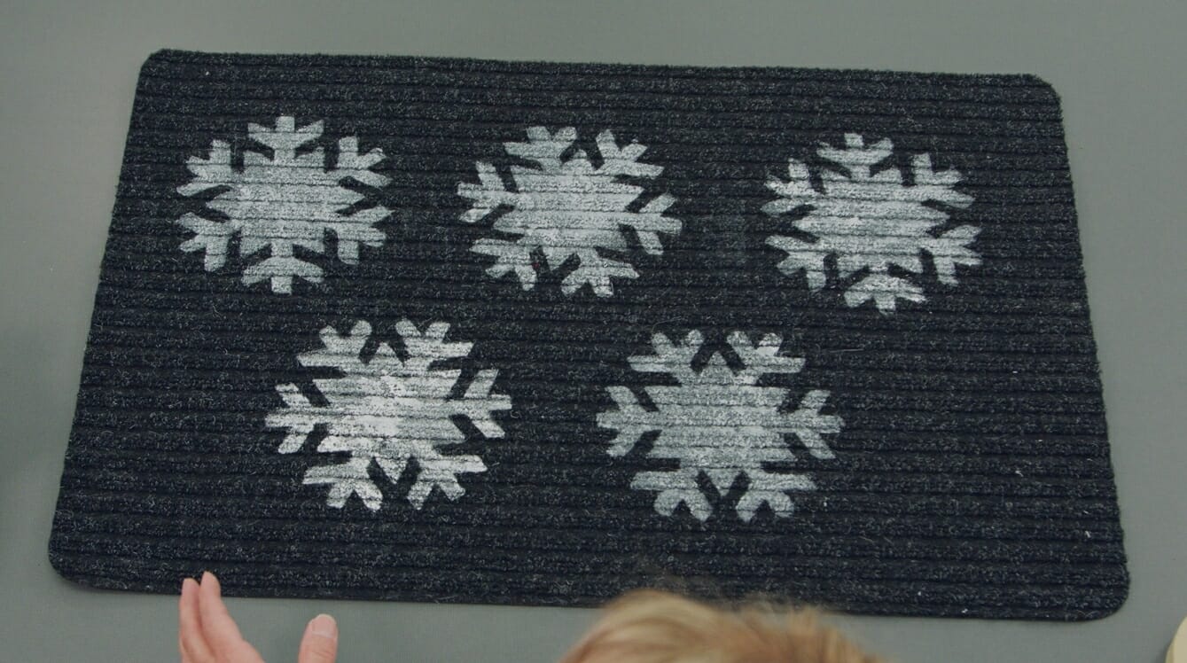 black floor mat with white snowflakes
