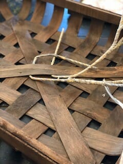 A woven basket with raffia.