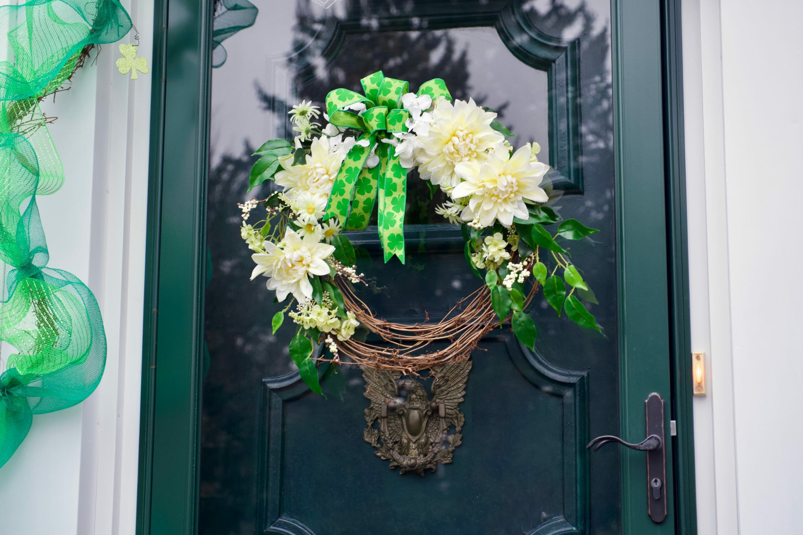 green and white flower wreath with St. Paddy shamrock ribbon