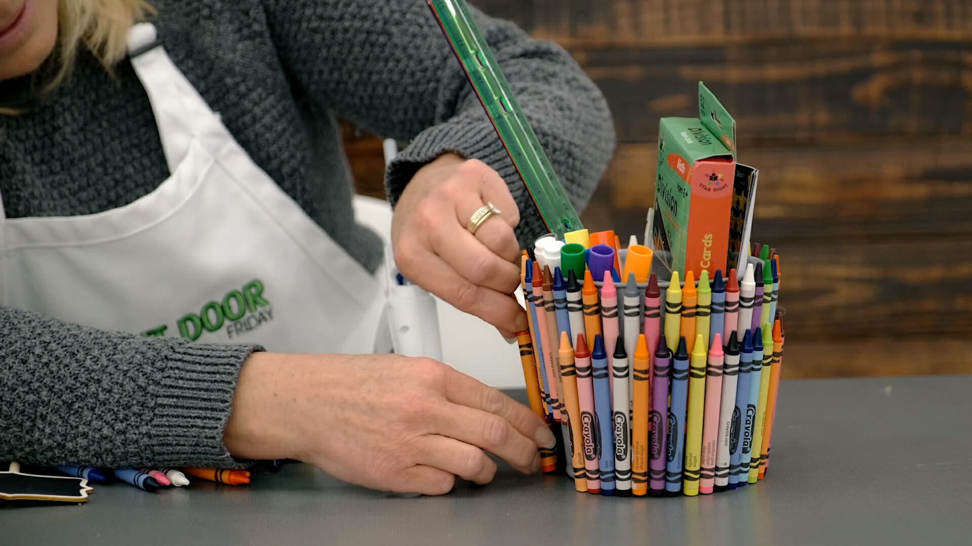 attaching crayons to basket