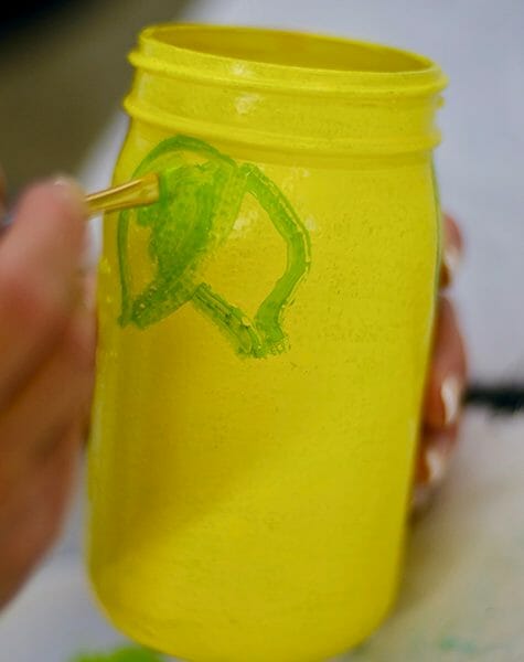 painting leaves on lemon Mason jar