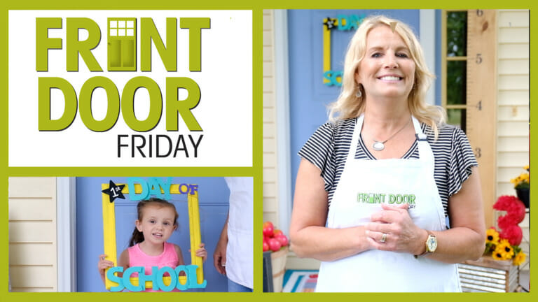 Front Door Friday – Smiling woman on a porch with a 1st Day of School frame on the door, and with a girl framing herself.