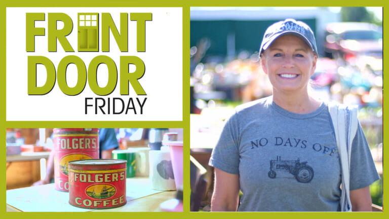 Front Door Friday – Smiling woman at a Flea Market, and a display with two sizes of vintage Folger's Coffee tins.