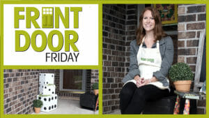 Front Door Friday – Smiling woman in an apron – A porch with DIY dice cubes and potted mums.