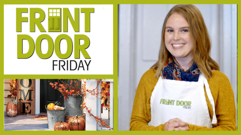 Front Door Friday – Smiling woman in an apron – A porch with pumpkins and galvanized tins of gourds and bittersweet.