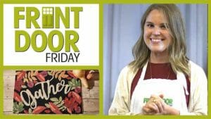 Front Door Friday – An Autumn leaves doormat with the word Gather, and a smiling woman in a Front Door apron.